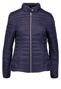 Veste matelassée bleu marine avec fermeture éclair frontale, col montant avec bouton-pression et deux poches latérales verticales zippées.