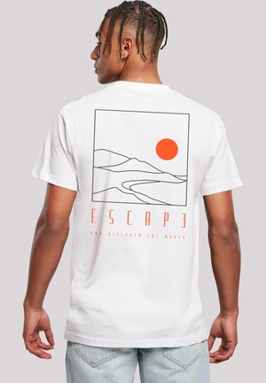 White cotton t-shirt featuring a graphic design with black outlining of mountains and an orange sun, text reading "ESCAPE" beneath.