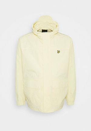 Veste à capuche jaune clair avec poignets élastiques, poches avant avec rabats et un petit logo oiseau jaune sur la poitrine gauche.