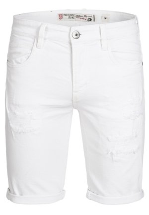 Shorts de mezclilla blanca con detalles desgastados y dobladillos enrollados. Incluyen bolsillos delanteros y cierre de botón metálico. Etiqueta visible en la parte interior de la cinturilla.