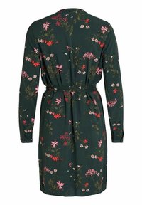 Robe longue à manches longues vert foncé avec motifs floraux roses, rouges et blancs, avec ceinture nouée à la taille et poignets boutonnés, vue de dos.