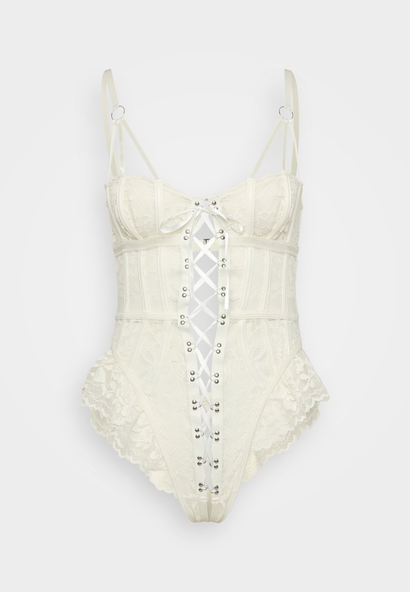 Crème kleurige kant bodysuit met verstelbare bandjes, kantafwerking en een voorzijde met vetersluiting met satijnen lint en metalen oogjes.