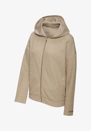 Beige zip-up hoodie with ribbed texture, spacious hood, and side pockets. Features flat seams and a subtle logo on the sleeve.