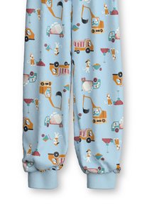 Pantalons de jogging bleu clair présentant un imprimé ludique de chiens et de véhicules de construction, avec des poignets élastiques et une texture de tissu douce.