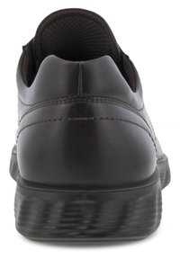 Scarpa in pelle marrone scuro con retro arrotondato, foderato in mesh testurizzato, e una suola in gomma nera resistente e leggermente rialzata.