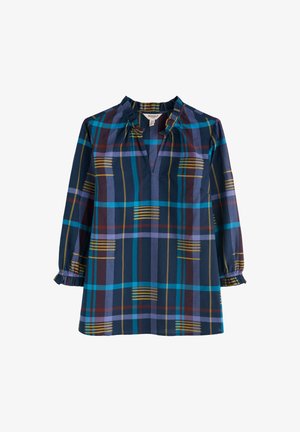 Blouse à manches longues en bleu marine avec un motif à carreaux multicolore. Présente un décolleté en V, des détails froncés aux épaules et des poignets à volants.
