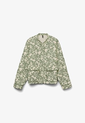 Veste crème avec motif de vigne florale verte, manches longues, deux poches avant et encolure sans col, présentée à plat sur fond blanc.