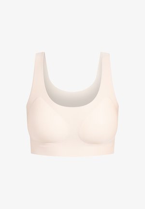 Beige Wireless-Bralette mit rundem Ausschnitt, breiten Trägern, glatter Textur und subtiler Formgebung. Nahtloses Design, keine sichtbaren Befestigungen.