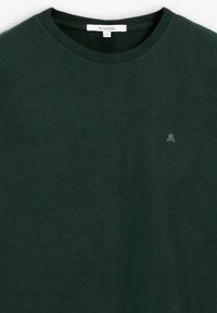 Dark green cotton T-shirt with a crew neck, featuring a small embroidered logo on the chest. Smooth texture, relaxed fit design.