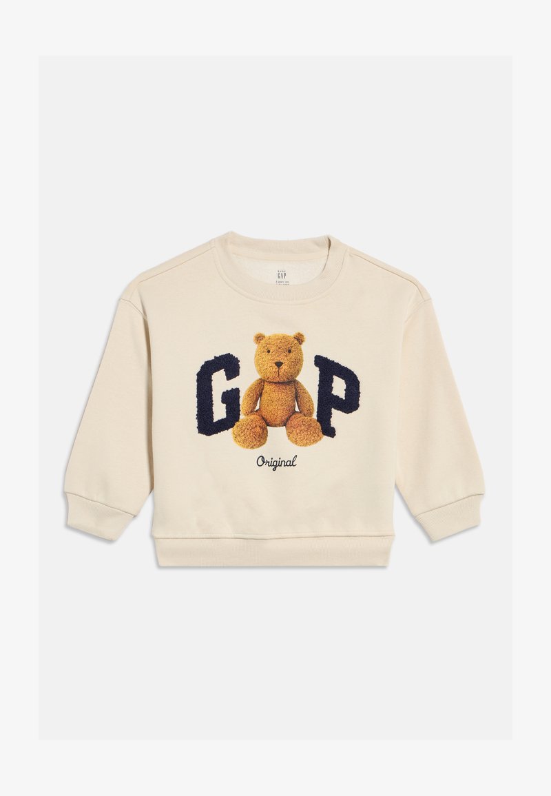 Krémová mikina pro batolata s medvídkem mezi velkými texturovanými tmavě modrými písmeny "G" a "P" a nápisem "Original" níže.