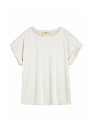 Beżowa, luźna koszulka z krótkim rękawem, z podwiniętymi mankietami i okrągłym dekoltem, rozłożona na płasko na białym tle.