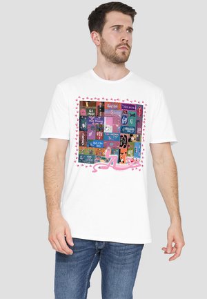 White cotton T-shirt featuring a colorful graphic collage with various designs in a square pattern, bordered by pink hearts.