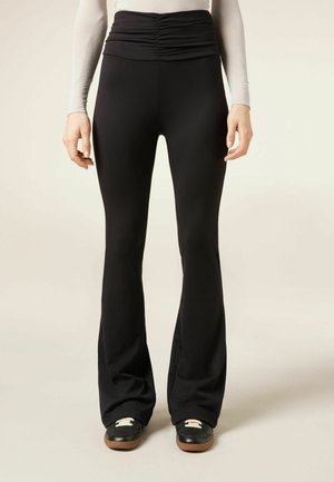 FLARE WITH RUCHING - Stoffhose - black
