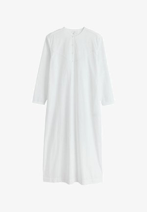 Dlouhé bílé šaty s dlouhými rukávy, kulatým výstřihem, předním zapínáním na knoflíky a jemným diagonálním švem na prsou.