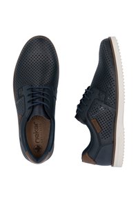 Navy perforated leather shoes with brown accents, featuring a rounded toe, lace-up design, and textured rubber sole for grip.
