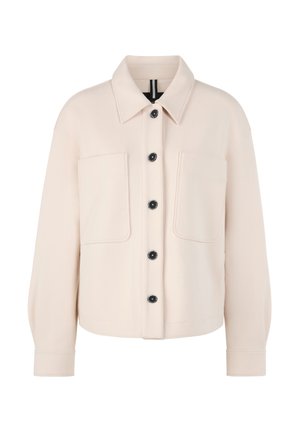 Light beige jacket with a collared neckline, two chest pockets, and black buttons. Fabric appears smooth with a relaxed fit and long sleeves.