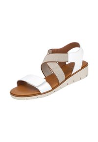 Sandalia blanca con correas texturizadas, cierre de velcro ajustable, plantilla en tono bronceado y suela de goma clara, con un diseño casual.