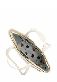 Krémově zbarvená kabelka s dvěma uchy, uzavíratelná na zip. Interiér je podšitý látkou s vzorem modrých a červených květin.