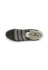 Black canvas sneaker with three grey elastic straps, white sole, and a textured design. Interior labeled "KAPORAL."