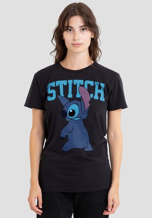 Black cotton t-shirt featuring a large blue cartoon character, Stitch, and bold turquoise text spelling "STITCH" above the character.