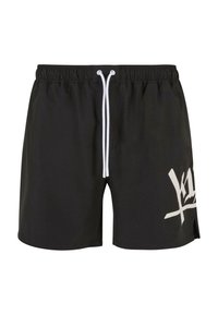 Sorte badeshorts med snøre i taljen, der har et stort hvidt grafisk design på venstre ben og sideslids ved kanten.