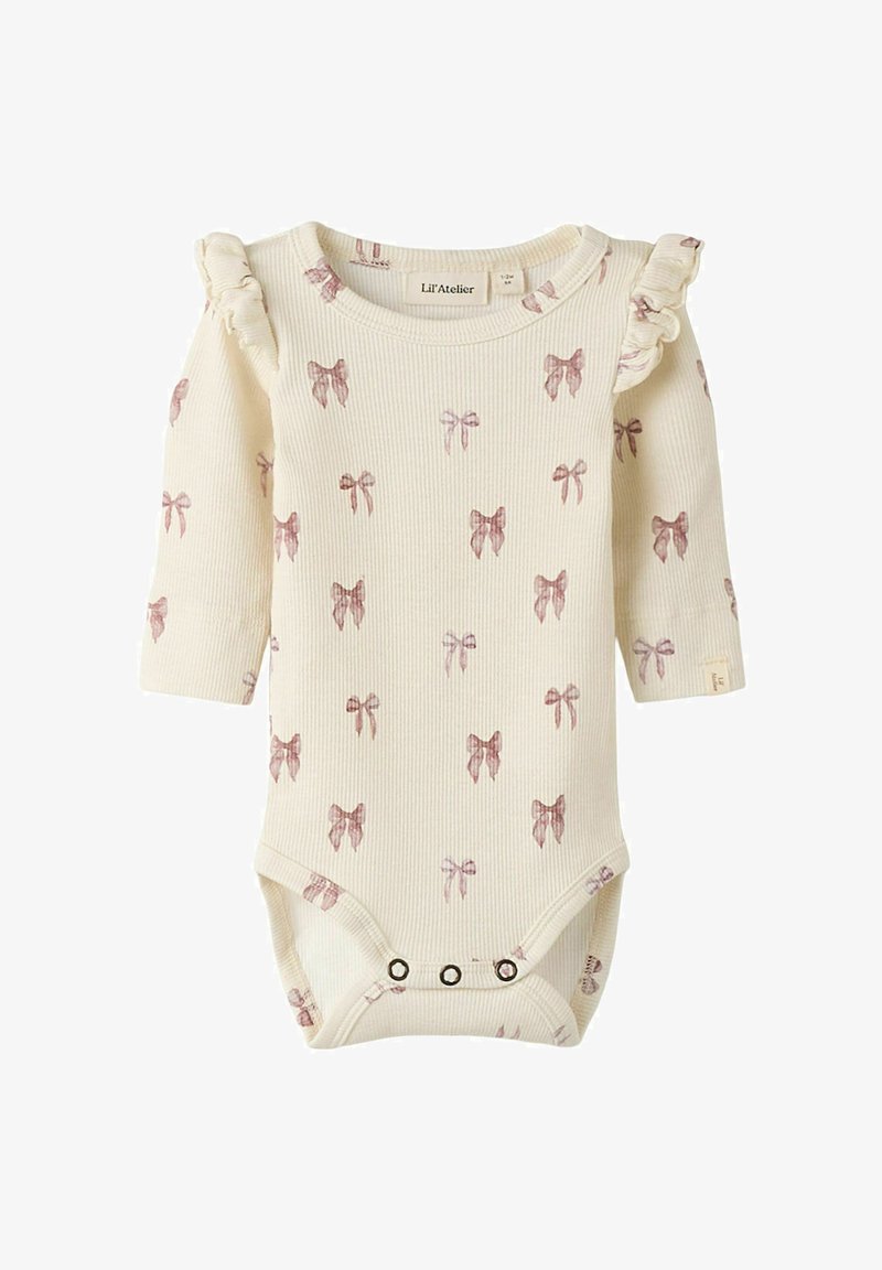 Body en côte crème à manches longues, avec petits motifs de nœuds roses, accents de volants aux épaules et fermetures à pression en bas.