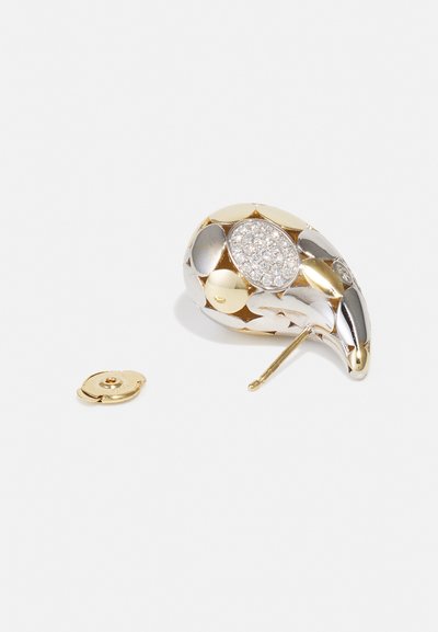 Gold and silver abstract-shaped earring with a textured surface, featuring a cluster of clear stones at the center and a removable backing.