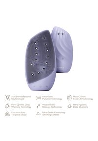Ansiktsrengöringsapparat i ljuslila, med en strukturerad silikonyta, ergonomisk form och metalliska detaljer för funktionalitet.