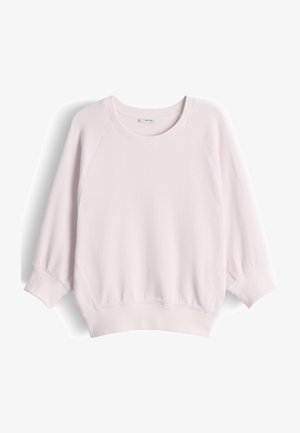 Felpa rosa chiaro con collo rotondo, maniche lunghe raglan e polsini e orlo a costine, mostrata su sfondo bianco.