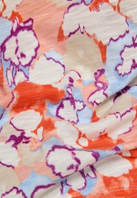 Lightweight fabric with a floral pattern in orange, purple, and blue on a cream background. Soft texture with subtle sheen.