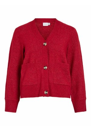 Punane kudumiste kardigan V-kaelusega, kahe eesmise taskuga ja viie nupuga. Pehme tekstuur, soonikkoes varrukate ja alla.