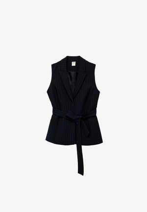 Sleeveless black pinstripe blazer vest with notched collar, single button closure, and a matching fabric belt tied at the waist.