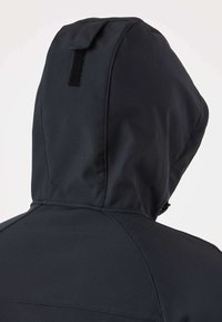 Black hooded jacket shown from the back with a visible seam design and a small rectangular Velcro patch on the hood.