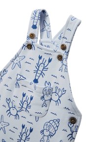 Salopette bleu clair avec un motif de homard et d'étoile de mer en bleu foncé. Caractéristiques : bretelles ajustables et poche avant avec fermeture à bouton.