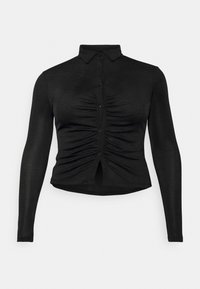 Camisa preta de manga longa com gola, abertura frontal com botões e detalhes franzidos na cintura. Tecido suave com silhueta ajustada.