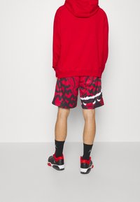 Mitchell & Ness Pantalón corto de deporte - black