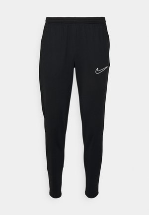 Sorte athletiske joggers med elastisk talje, slim fit og hvidt Nike-logo på venstre side. Blødt stof med en glat tekstur.