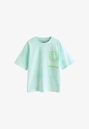 Šviesiai žalios spalvos trumpomis rankovėmis marškinėliai su apvalia apykakle, ant krūtinės esantis žalias besišypsančio veido piešinys ir užrašas „NIRVANA NEVERMIND“.