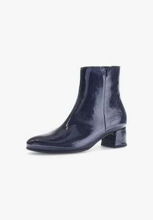 Navy blue ankle boots made of glossy material with a block heel, featuring a smooth texture and pointed toe design.