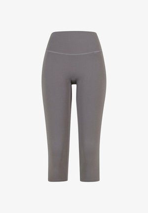 Grå caprileggings gjorda av ett mjukt, stretchigt material med ett brett midjeband och utan synliga sömmar, designade för komfort och rörlighet.