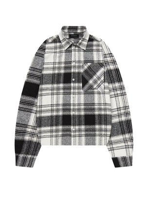 Chemise à carreaux noir et blanc, en coton, à manches longues, col boutonné, poche poitrine unique avec un motif diagonal, coupe droite.