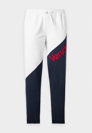 Versace, INTARSIA WORKING AND CUT OUT VINTAGE LOGO EMBROIDERY - Pantalon de survêtement - white/navy blue