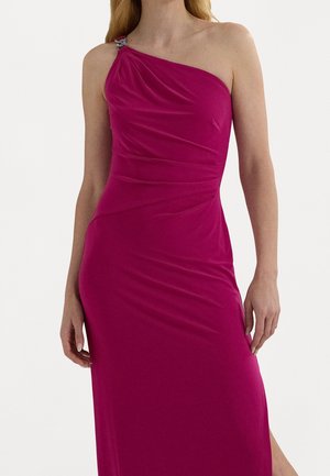 Fuchsia one-shoulder dress made of soft, stretchy material. Features draped fabric and a decorative hardware accent at the shoulder.