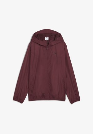 Bordeauxfarbene Windbreaker-Jacke aus leichtem Stoff. Mit Kapuze, elastischen Bündchen und seitlichen Taschen. Schwarzes Logo auf der Brust. Glatte Textur.