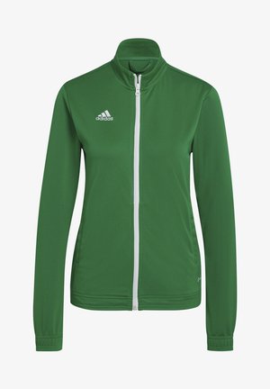 Zielona kurtka Adidas z pełnym zamkiem błyskawicznym, białym zamkiem i logo na piersi, z długimi rękawami i wysokim kołnierzem.