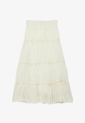 Lange crème kleurige rok met lagen, voorzien van een elastische tailleband en kanten rand die elke geplooide sectie scheidt.