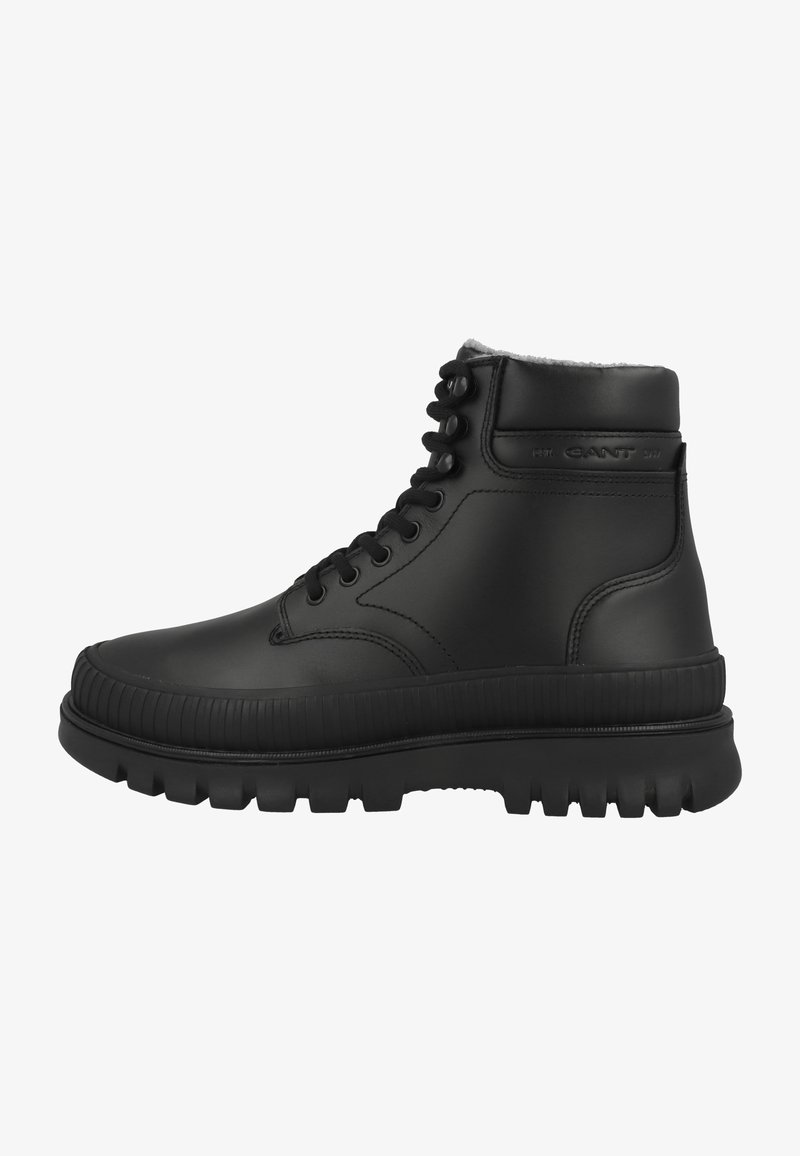 Black leather ankle boot with lace-up front, padded collar, thick treaded sole, and subtle brand embossing on the side.