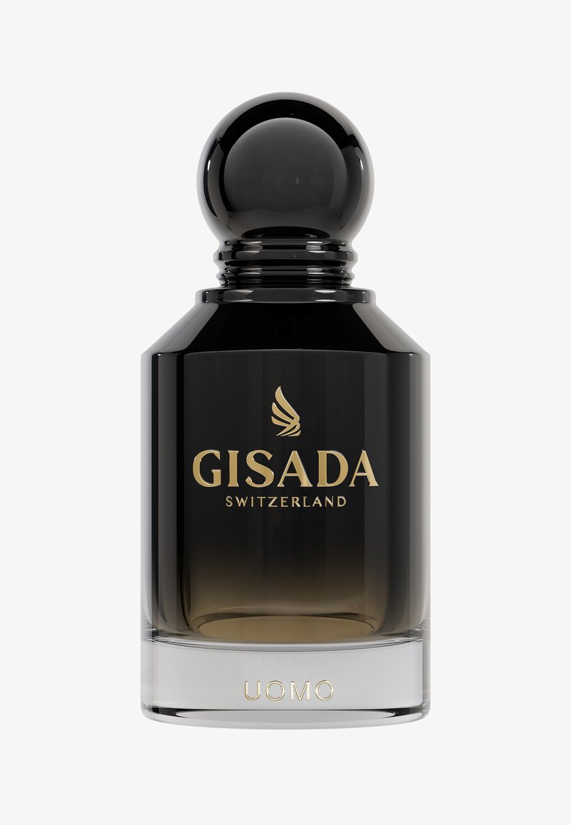 Czarna szklana butelka perfum z okrągłą czarną zakrętką. Złote logo "GISADA SWITZERLAND" oraz napis "UOMO" u podstawy. Gradient od czerni do przejrzystości.