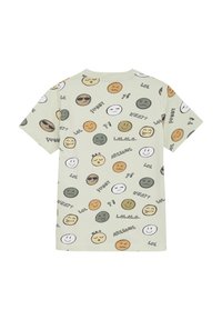 Ljusgrön kortärmad t-shirt med en rad olika smiley-emojis och textelement i ett upprepande mönster. Tillverkad av mjukt tyg.