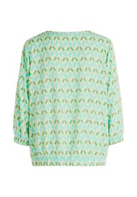 Blusa leggera color verde menta con motivi geometrici. Presenta una vestibilità ampia, fondo elasticizzato e maniche a tre quarti. Texture morbida e liscia.